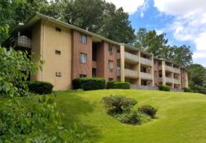 Exterior of gorgeous Heritage Crystal Springs apartment overlooking well-maintained hill in Chester County, PA