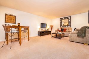 Heritage Greene apartment with furnished finished basement that has carpeted flooring in Sellersville, PA