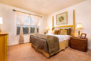 Beautiful model bedroom with carpeted flooring and large window in Sellersville, PA apartments