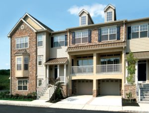 Exterior of Heritage Pointe apartments with spacious parking spaces in Bucks County
