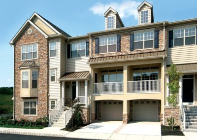 Exterior of Heritage Pointe apartments with spacious parking spaces in Bucks County