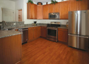 Heritage Orchard Hill kitchen with wood cabinets and stainless steel appliances in Perkasie, PA