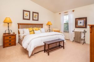 Spectacular model bedroom with carpeted flooring and medium window in Bucks County apartments